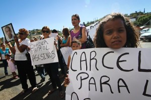 From left to right: Taide Elena, Araceli Rodriguez, Selma Barrón and Andrea Paula Elena Rodriguez, Jose Antonio's younger sister, protest in front of the U.S./Mexico port of entry Saturday morning. About 30 family members, friends and supporters of Jose Antonio attended the protest, which started at Plaza de Hildalgo and continued to the port of entry and then to the site where Elena Rordriguez was shot. Credit: Josh Morgan